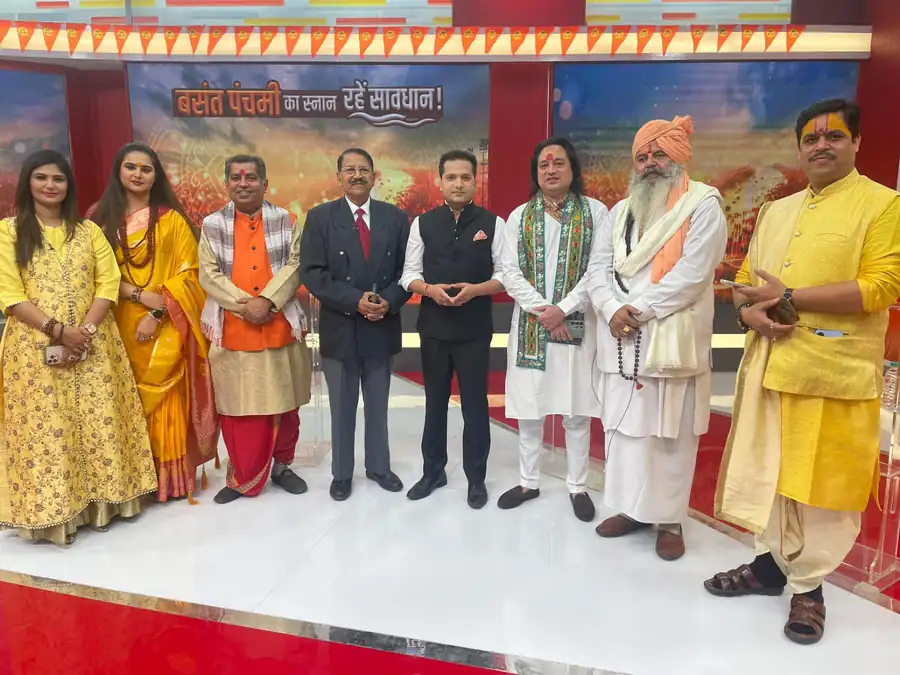 Gaurav with guests on a TV show set