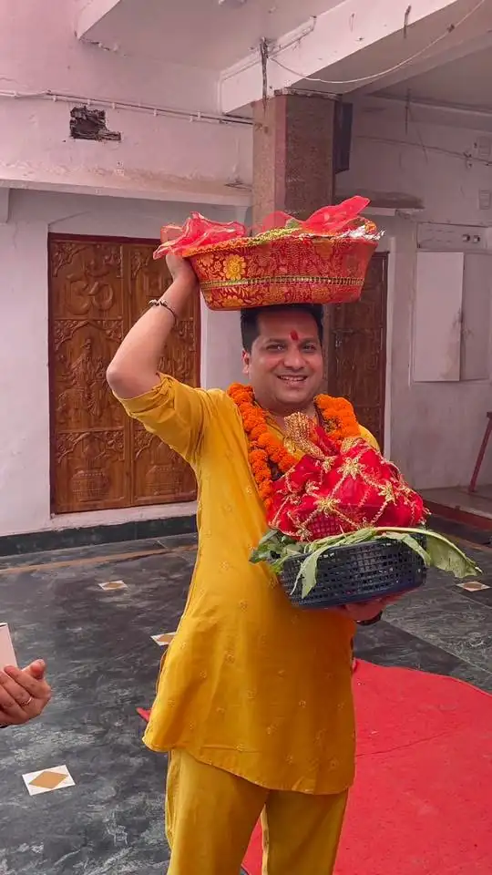 Gaurav carrying a basket of flowers for a pooja