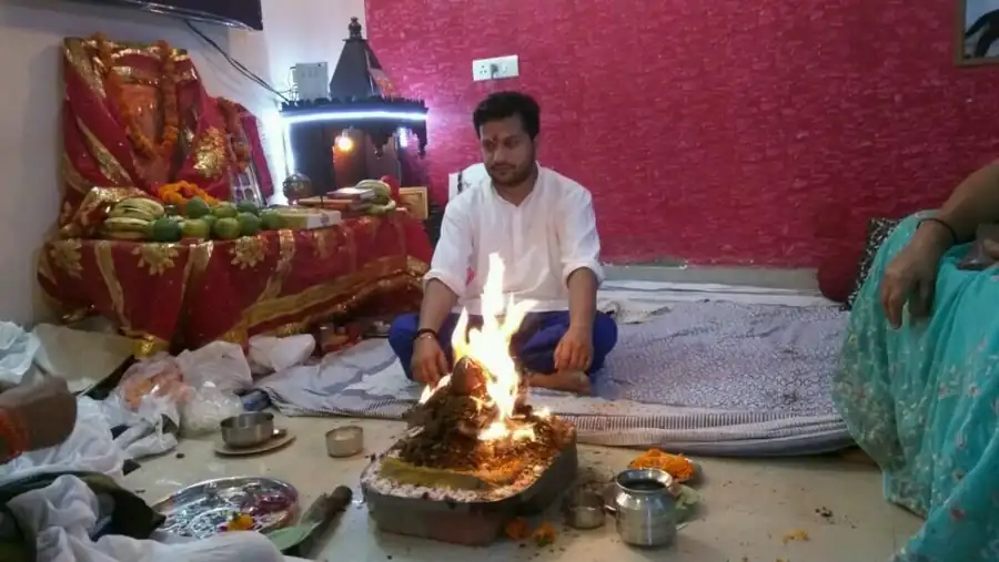Gaurav performing a havan at home